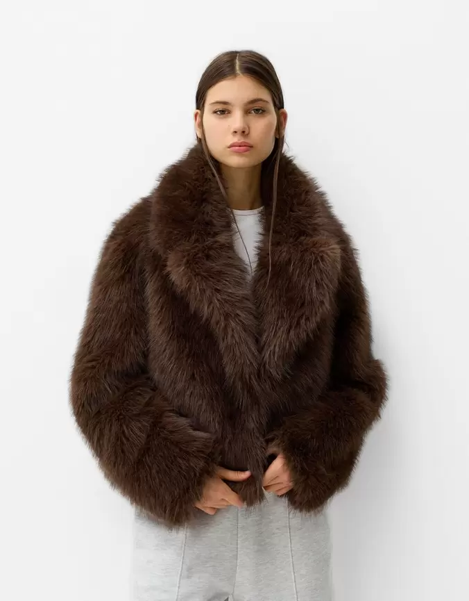 Faux fur jacket with lapel collar offers at £79.99 in Bershka