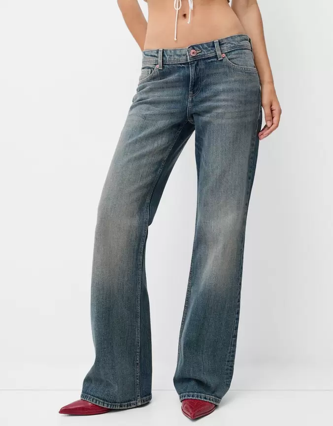 Low waist boot-cut jeans offers at £29.99 in Bershka