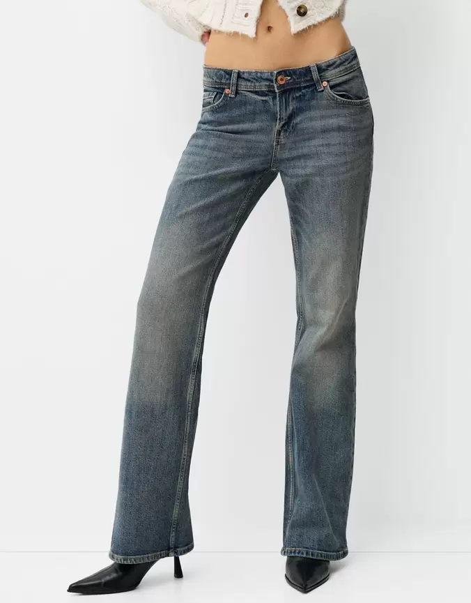 Low waist boot-cut jeans offers at £29.99 in Bershka