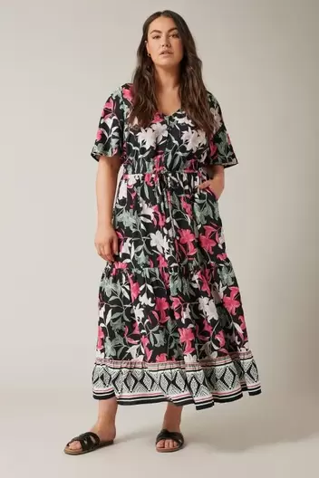 EVANS Curve Black Floral Design Border Print Midi Dress offers at £25 in Evans