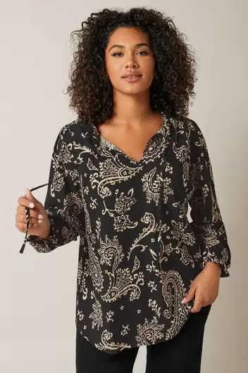 EVANS Curve Black Paisley Print Crepe Tie Neck Blouse offers at £20 in Evans