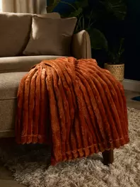 Ribbed Coral Throw offers at £10 in The Original Factory Shop