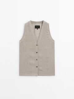 Waffle-knit V-neck vest offers at £89.95 in Massimo Dutti