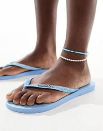 Havaianas slim glitter iridescent flip flops in blue offers at £36 in ASOS