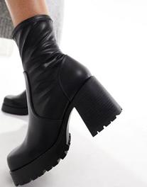 ASOS DESIGN Retreat mid-heeled sock boots in black offers at £24 in ASOS