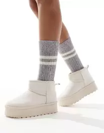 SEQWL mini flatform boots in cream offers at £228 in ASOS