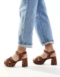 Yours cross over block heels in leopard offers at £62.99 in ASOS