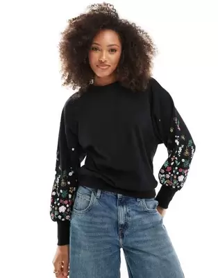 ONLY crew neck jumper with floral sleeve detail in black offers at £26 in ASOS