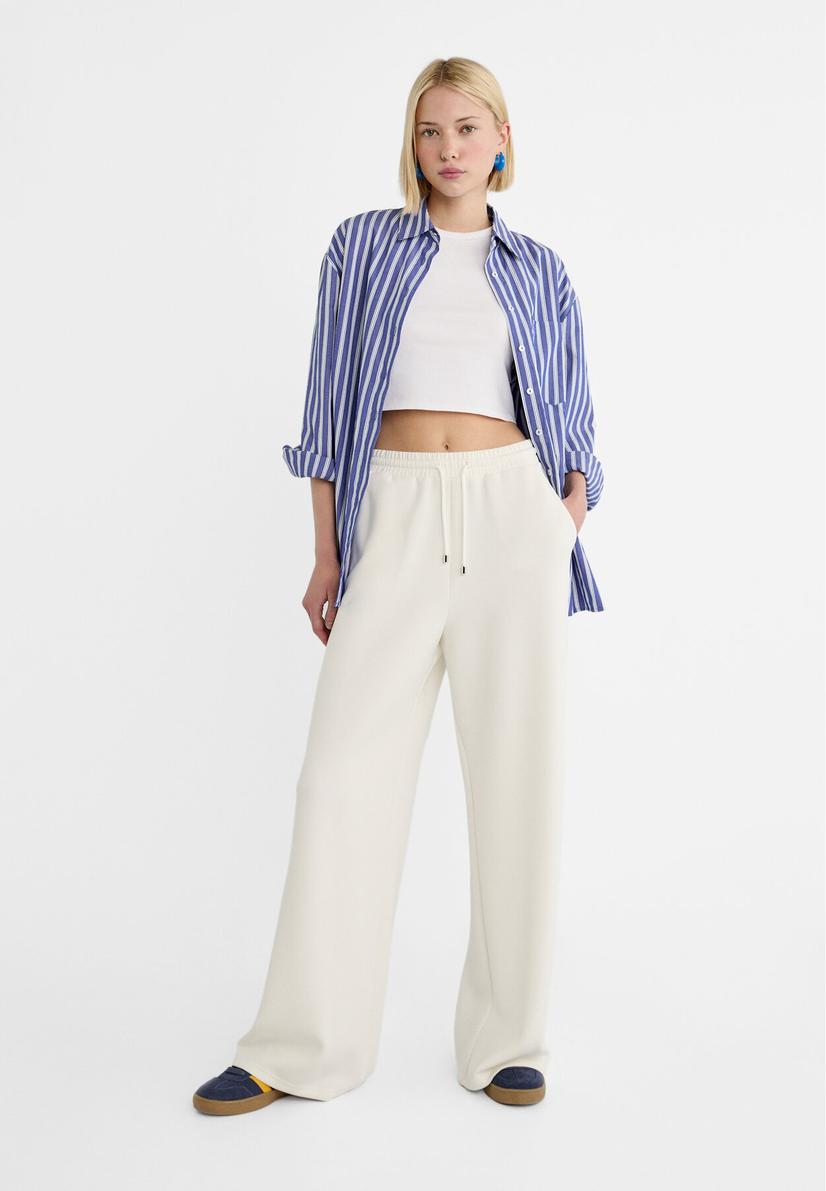 Soft-touch palazzo trousers offers at £29.99 in Stradivarius
