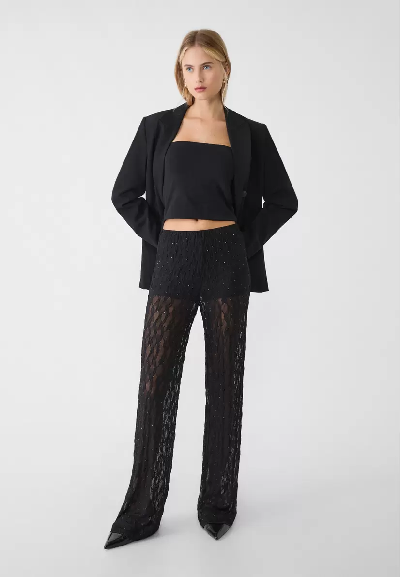 Lacey trousers with rhinestones offers at £35.99 in Stradivarius