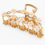 Gold Daisy Studded Oval Hair Claw offers at £6.4 in Claire's