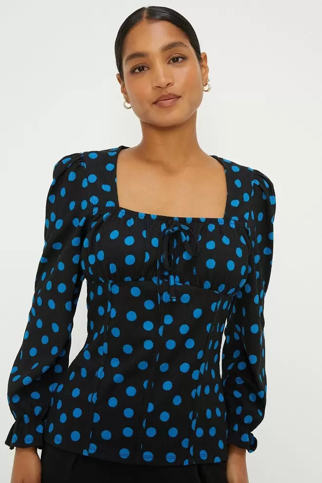 Spot Shirred Cuff Textured Long Sleeve Top offers at £9.9 in Dorothy Perkins